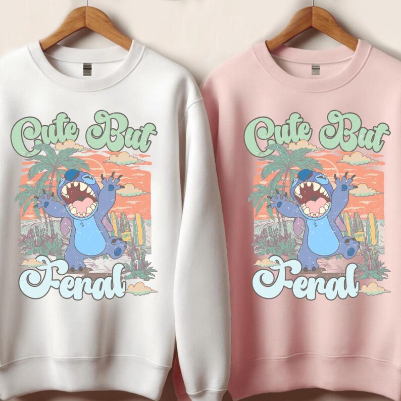 a couple of sweatshirts hanging on a wall