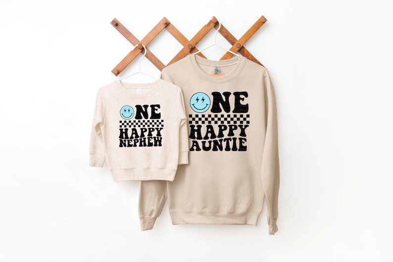 a couple of sweatshirts hanging on a wall