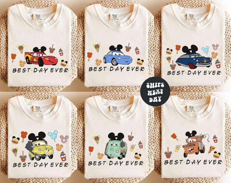 six white t-shirts with various cartoon car designs and the text "BEST DAY EVER" printed on them.