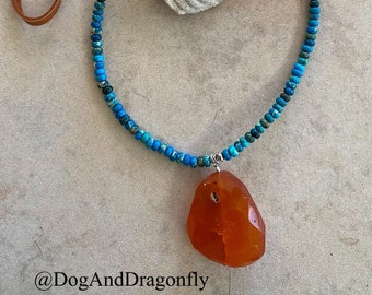 Apatite surrounding a Carnelian on Brown Leather Necklace