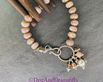 Vintage glass beads with a sterling silver sweet tea cup charm bracelet