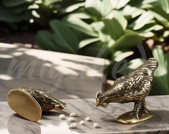 May include: Two gold-colored metal figurines of chickens. One chicken is pecking at white beads on a marble surface. The other chicken is facing the opposite direction.