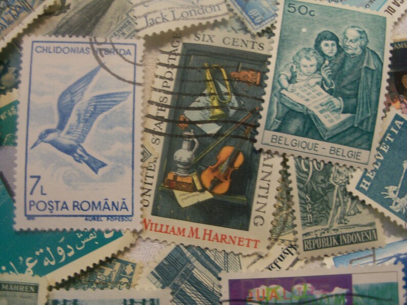 May include: A collection of vintage postage stamps, featuring various designs and countries. Stamps include a blue bird, a still life with a violin, and a stamp with a family reading. The stamps are in various colors and sizes.