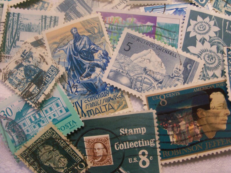 May include: A collection of vintage postage stamps with various designs and colors. Stamps feature images of historical figures, landscapes, and text, including "Stamp Collecting" and "U.S. 8 Cents."