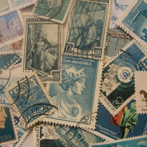 May include: A collection of vintage postage stamps in various sizes and shapes, featuring diverse designs and colors. Stamps depict historical figures, buildings, and scenes, with text in multiple languages. The stamps are primarily shades of blue, green, and brown.