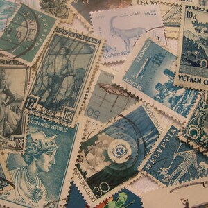 May include: A collection of vintage postage stamps in various sizes and shapes, featuring diverse designs and colors. Stamps depict historical figures, architectural structures, and nature scenes. Some stamps have text in multiple languages, including "POSTE ITALIANE" and "VIET-NAM CONG HOA."