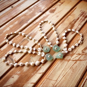 Dainty puka shell anklet with seafoam seaglass closure.