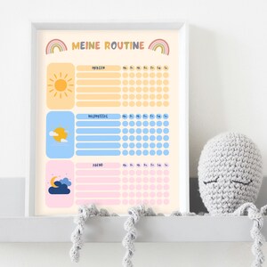 May include: A printable chart with a colorful design featuring a sun, clouds, and a moon. The chart is titled "Meine Routine" and has sections for "Morgen", "Nachmittag", and "Abend". Each section has a space for writing and a grid of circles for tracking.