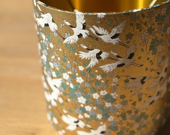 Luxury lampshade with a beautiful brushed-metal gold interior and gold/blue exterior