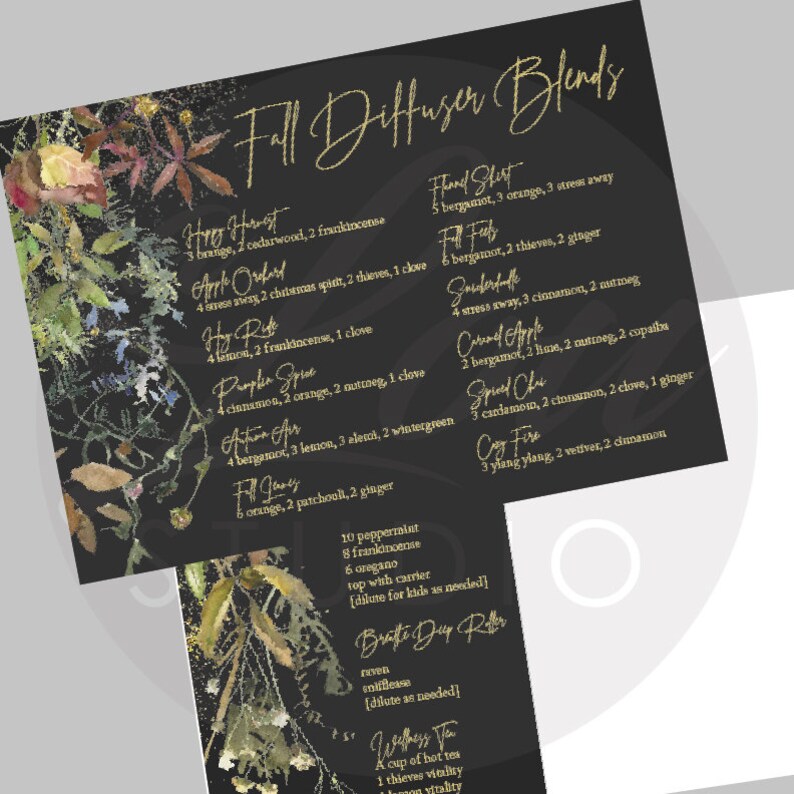 May include: A black print with gold text detailing essential oil diffuser blends for autumn. The blends include ingredients such as orange, cinnamon, and clove. Floral and botanical decorations adorn the edges of the print.
