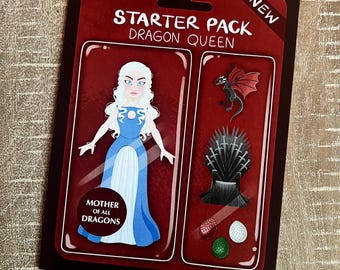 May include: A red and black "Starter Pack Dragon Queen" card featuring a cartoon of a woman in a blue dress, a black dragon, a throne, and dragon eggs. The text "Mother of All Dragons" is also visible.