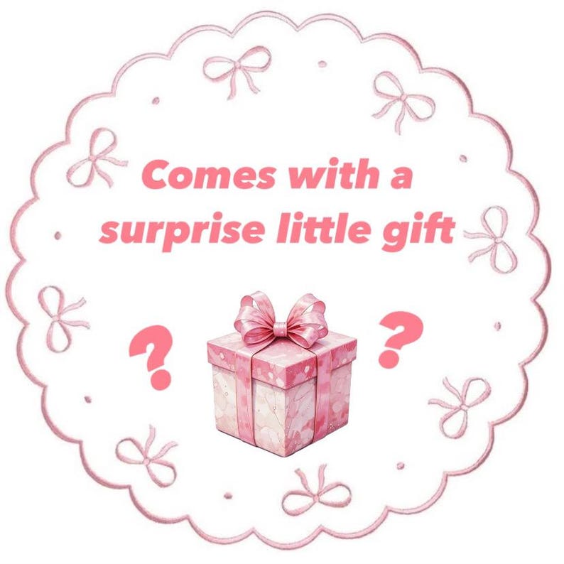 May include: A pink gift box with a matching bow, surrounded by a scalloped border with bows. The text "Comes with a surprise little gift" is displayed in pink, along with two question marks.