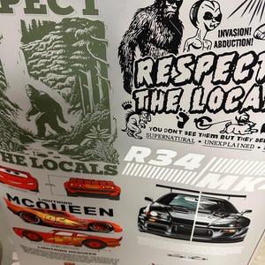 May include: A sheet of stickers featuring various designs. Included are images of Bigfoot, an alien, and Lightning McQueen from the movie Cars. Text includes "Respect the Locals" and "Invasion! Abduction!"