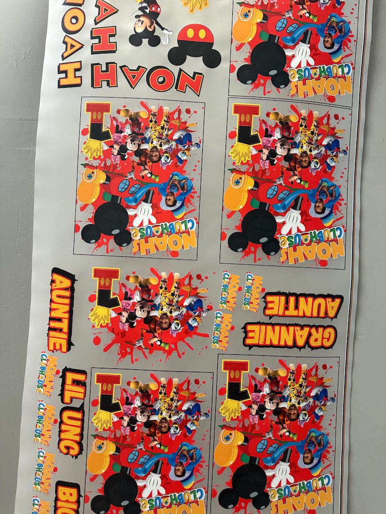 May include: A sheet of printed designs featuring Mickey Mouse and friends. The designs include the name "Noah" and the phrase "Noah's Clubhouse" in various arrangements. Other text includes "Auntie", "Grannie", "Lil Ung", and "Big".