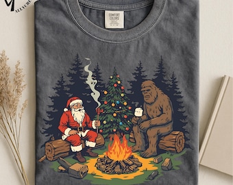 Funny Bigfoot Christmas Shirt, Santa and Sasquatch Camping Tee, Retro Xmas Gift for Men, Funny Holiday Campfire Sweatshirt