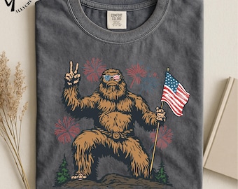 Patriotic Bigfoot T-Shirt, Funny Sasquatch USA Tee, American Flag Shirt, Comfort Colors Top, July 4th Fireworks T-Shirt