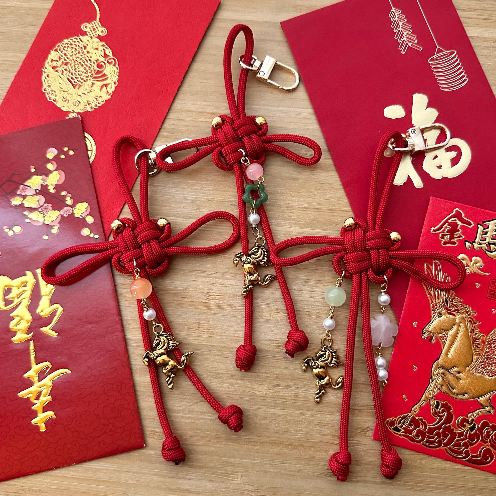 Three red good luck knot keychains