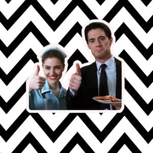 May include: A digital image featuring two people giving thumbs up. One person is wearing a blue uniform and the other is wearing a black suit and tie. The background is a black and white zigzag pattern.