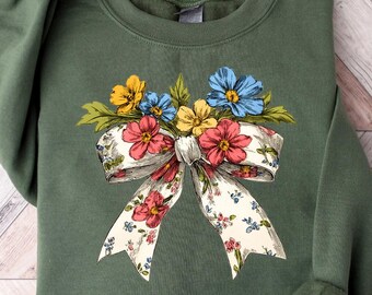 Blommig vår-kokettröja med rosett, söt mammatröja, vårtröja för kvinnor, botanisk t-shirt, blommig rosett-tröja, vildblommig vår-t-shirt