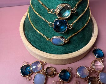 Brass square charm links with glass stones.