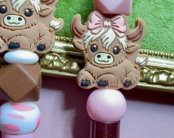 beaded pens with yak/cow/animal characters