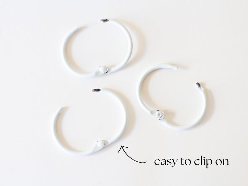 May include: Three white metal rings with a clip closure. The rings are easy to clip on and off.