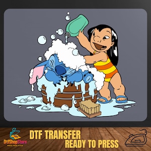 May include: A cartoon image of Lilo washing Stitch in a wooden barrel filled with bubbles. Lilo is wearing a yellow and orange striped swimsuit. The image includes the text "DTF TRANSFER READY TO PRESS".