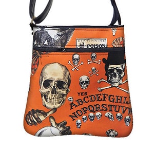 May include: Orange crossbody bag with a spooky design featuring skulls, crossbones, and an Ouija board alphabet. The bag has a black strap and zipper, with the word "POISON" visible.
