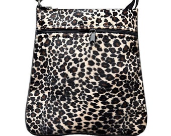 May include: A black and brown leopard print crossbody bag with a zipper closure.
