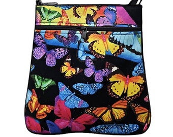 May include: A black crossbody bag with a colorful butterfly print. The bag has two zippered compartments and a black adjustable strap.