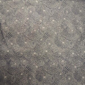 May include: A dark blue fabric with a white pattern of small, starburst-like shapes.