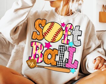May include: A white sweatshirt with a colorful graphic design that says "Softball" with a yellow and red softball and a baseball bat.