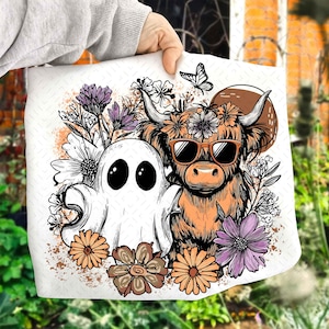 May include: White fabric featuring a whimsical illustration of a ghost and a Highland cow wearing sunglasses, surrounded by flowers and a butterfly. The design incorporates orange, purple, and brown tones, creating a unique and artistic aesthetic.