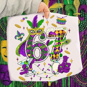 May include: A white graphic with a Mardi Gras design, featuring the number "67" in purple and green. The image includes a mask, beads, a cocktail, a drum, and gold coins. The graphic is held by a person.