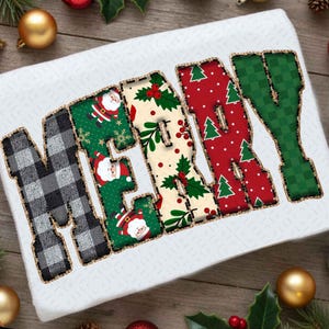 May include: A white rectangular item with the word "MERRY" spelled out in large, decorative letters. The letters are in various patterns, including black and white plaid, Santa Claus, Christmas trees, and holly berries. The letters have a stitched border.