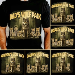 May include: Black t-shirts with various "WOLF PACK" designs. Each design features a wolf and several wolf pups, with names below. The designs include "DAD'S WOLF PACK", "GRANDPA'S WOLF PACK", "PAPA'S WOLF PACK", "PAWPAW'S WOLF PACK", "DADDY'S WOLF PACK", and "FATHER'S WOLF PACK".