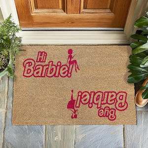 a door mat that says happy birthday and a door mat with a picture of a
