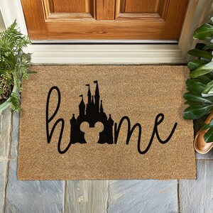 a door mat with the word home written on it