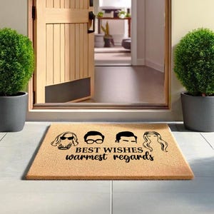 a door mat with the words best wishes and a woman's head on it