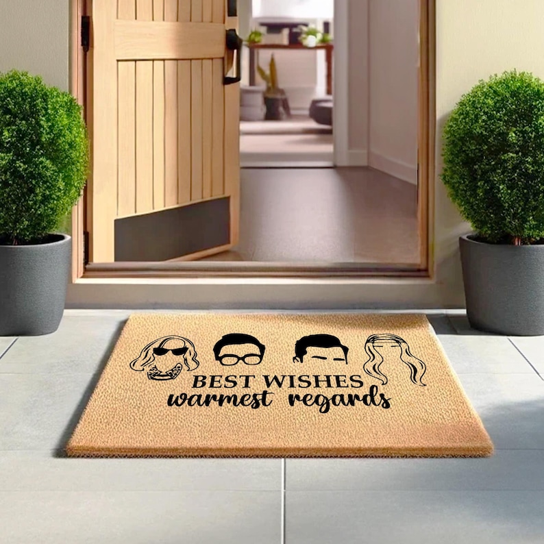 a door mat with the words best wishes and a woman's head on it