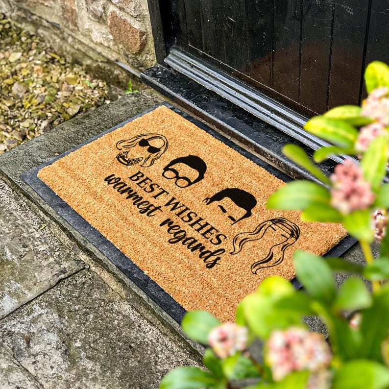a door mat with a picture of a man and woman on it