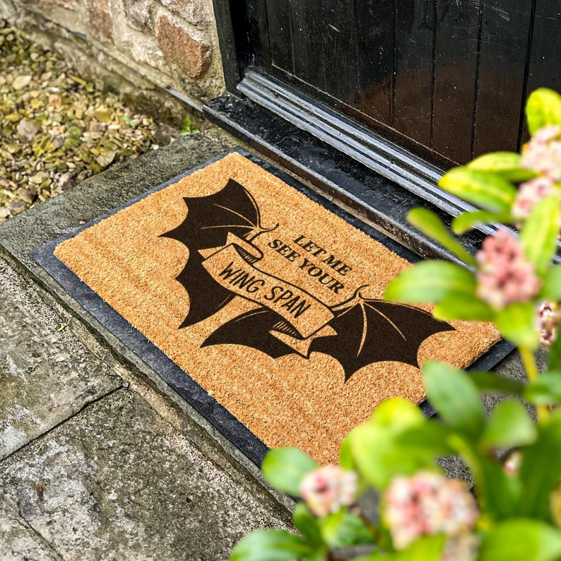 a door mat with a bat on it