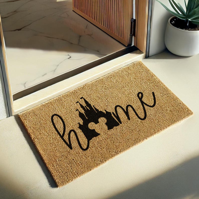 a door mat with the word mickey on it