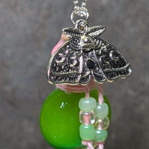 Luna Moth Potion Necklace. Bottle and charm on necklace chain