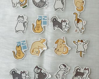 May include: A collection of colorful stickers featuring various cartoon cats and dogs in playful poses. The stickers showcase a range of breeds and activities, including sleeping, dancing, and playing. The stickers are on a white background.