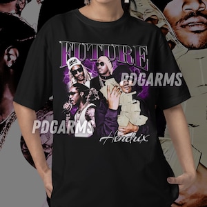 May include: Black t-shirt with a graphic print of four men, including Future and Jimi Hendrix. The graphic is in purple and white with the text "FUTURE" and "PDGARMS" on the shirt.