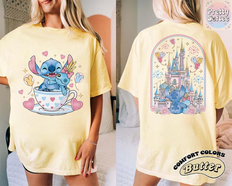 May include: Yellow t-shirt featuring a cartoon Stitch design. The front shows Stitch in a teacup with hearts and balloons. The back displays a castle scene with Stitch and fireworks. The shirt has the text "Comfort Colors Butter".