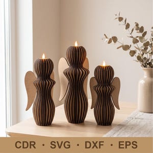 May include: Three angel-shaped candle holders made of layered dark brown material with flat, light brown wing attachments. Each figure features a vertical ribbed texture and a small, glowing LED candle flame at the top. Text reads: CDR • SVG • DXF • EPS.
