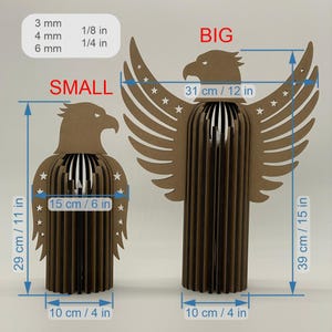 May include: Two brown eagle sculptures, one small and one large. The small eagle is 11 inches tall and 4 inches wide. The large eagle is 15 inches tall and 4 inches wide, with a wingspan of 12 inches. Both have star accents.