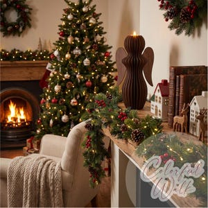May include: A dark brown wooden angel figurine with a smooth, ribbed, vertical design and extended wings, featuring a small lit candle at the top. The angel is positioned on a wooden surface next to a green garland with red berries and pinecones.